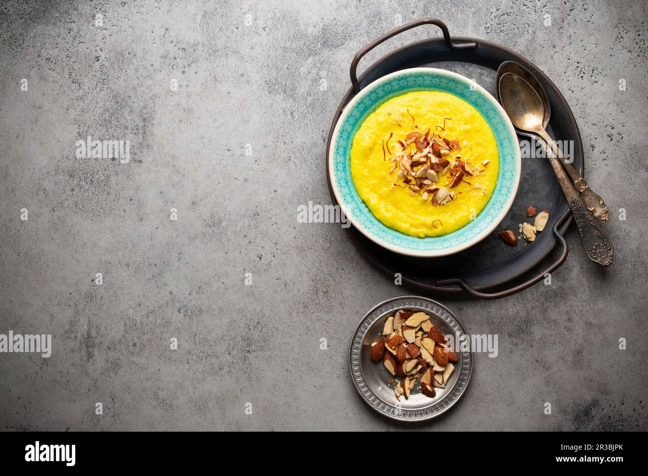 Traditional Indian kheer (Sweet rice milk pudding with almonds and ...