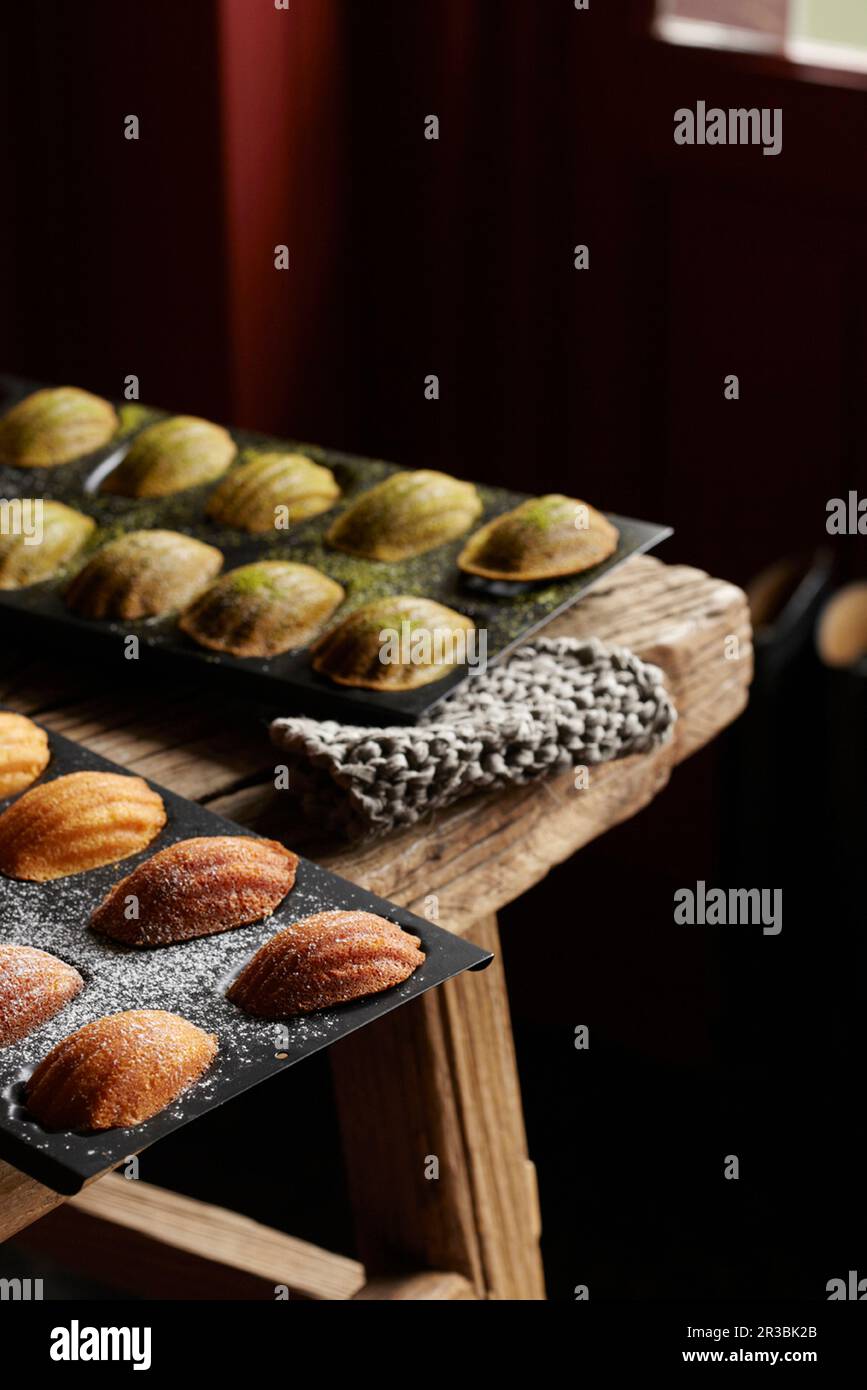 Two types of madeleines in baking tins Stock Photo Alamy