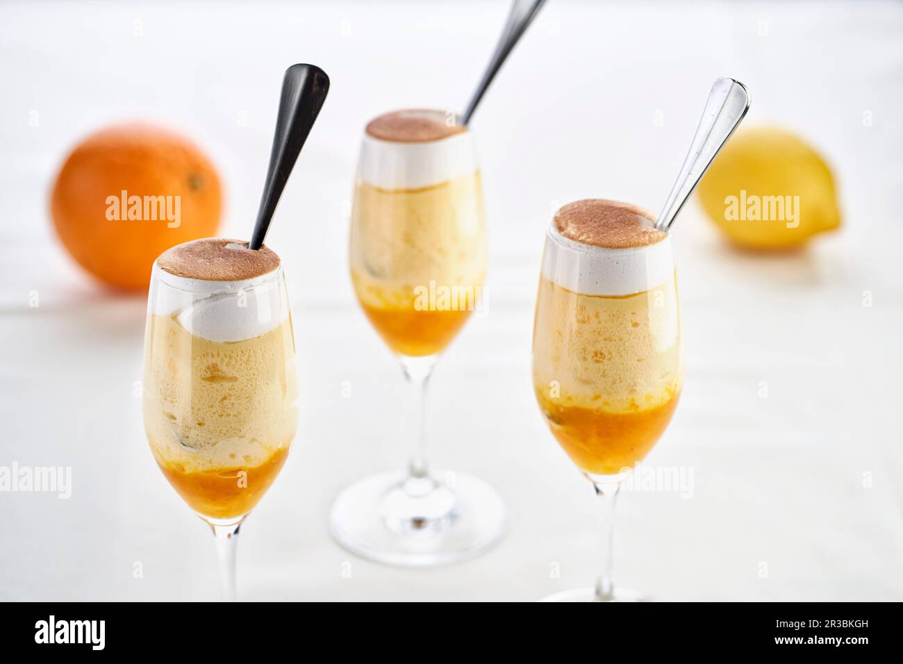 Orange and lemon desserts in glasses Stock Photo Alamy