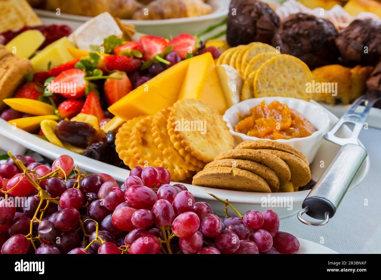 Fruit Salad and cheese board at Spring Festival picnic event Stock Photo