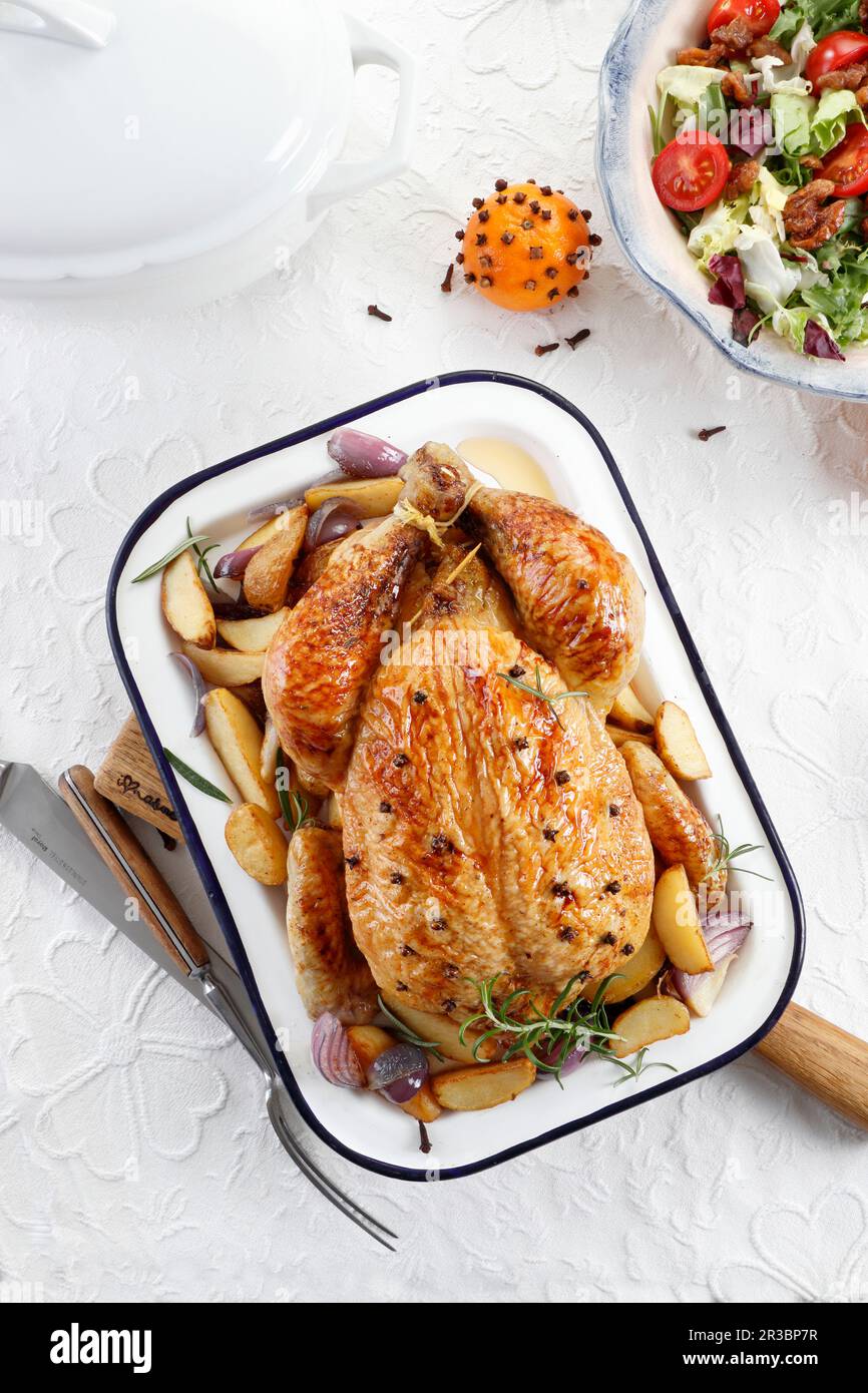 Roast chicken seasoned with cloves Stock Photo