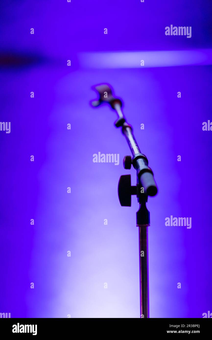 Empty microphone stand on a stage Stock Photo