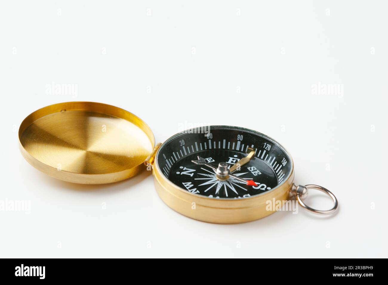 Golden vintage compass isolated on white background Stock Photo - Alamy