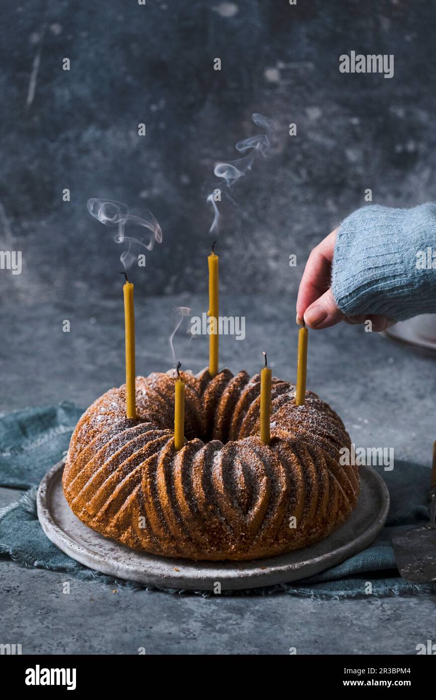 Bundt cake with candles Stock Photo