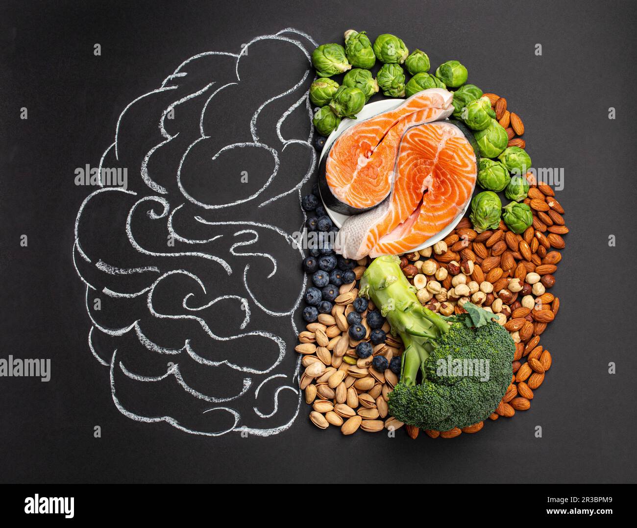 Chalk hand drawn brain with assorted food, food for brain health and good memory Stock Photo