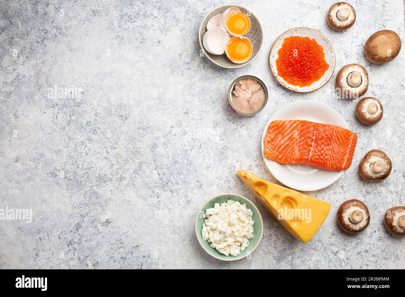 Selection of natural sources of vitamin D (Fish, cheese, eggs, mushrooms) Stock Photo