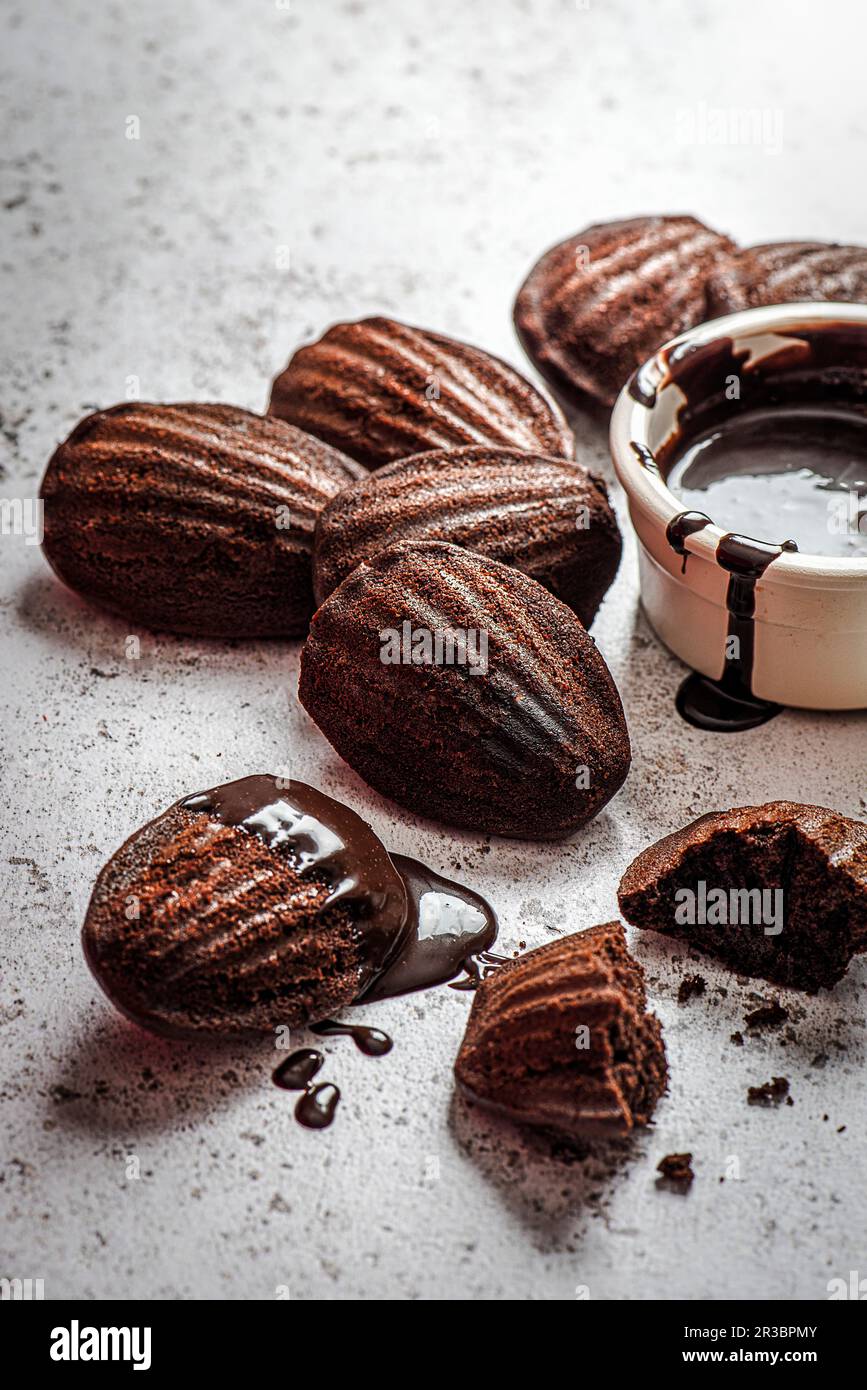 Chocolate madeleines with chocolate dipping sauce Stock Photo