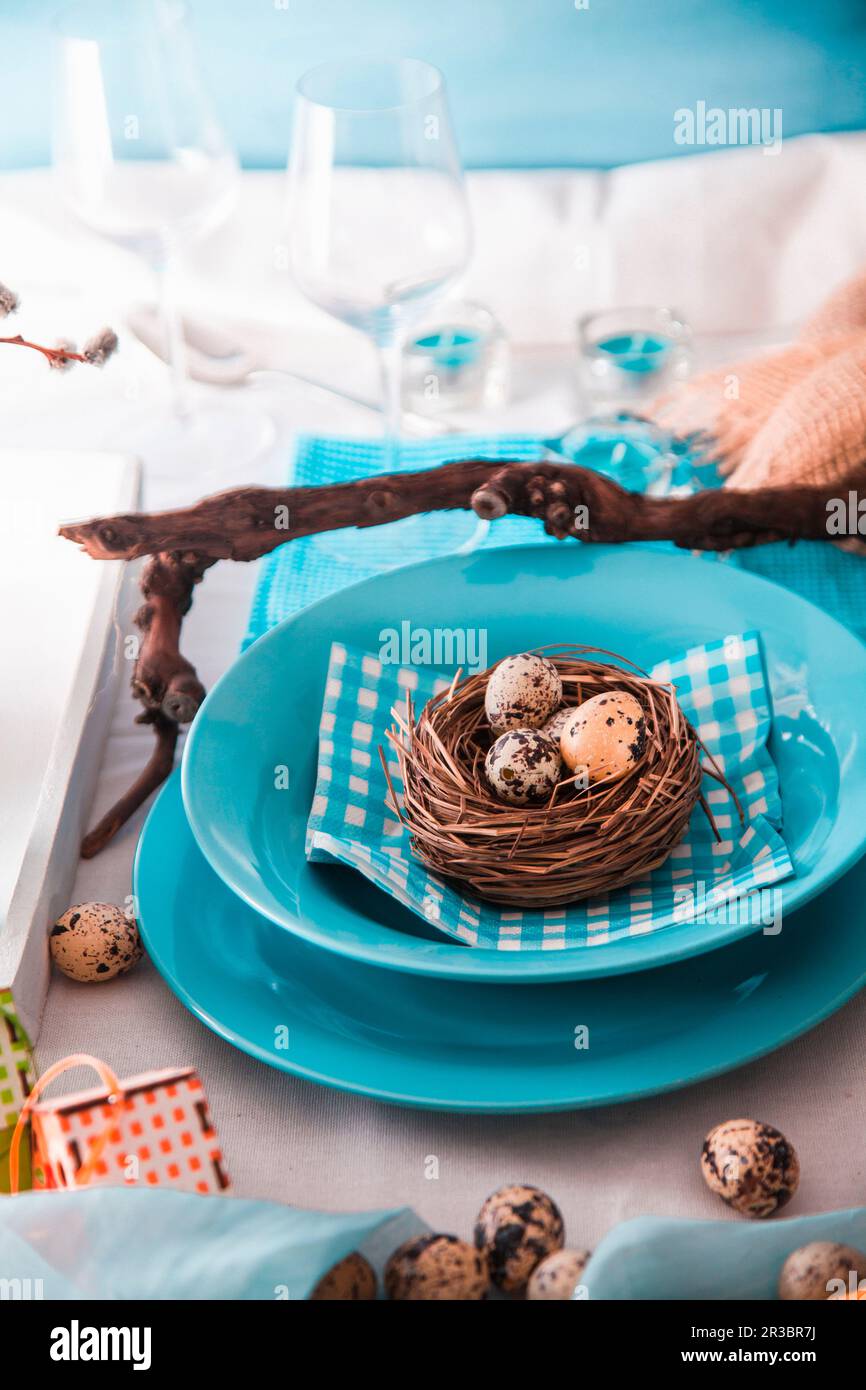 Easter table setting with quail eggs Stock Photo