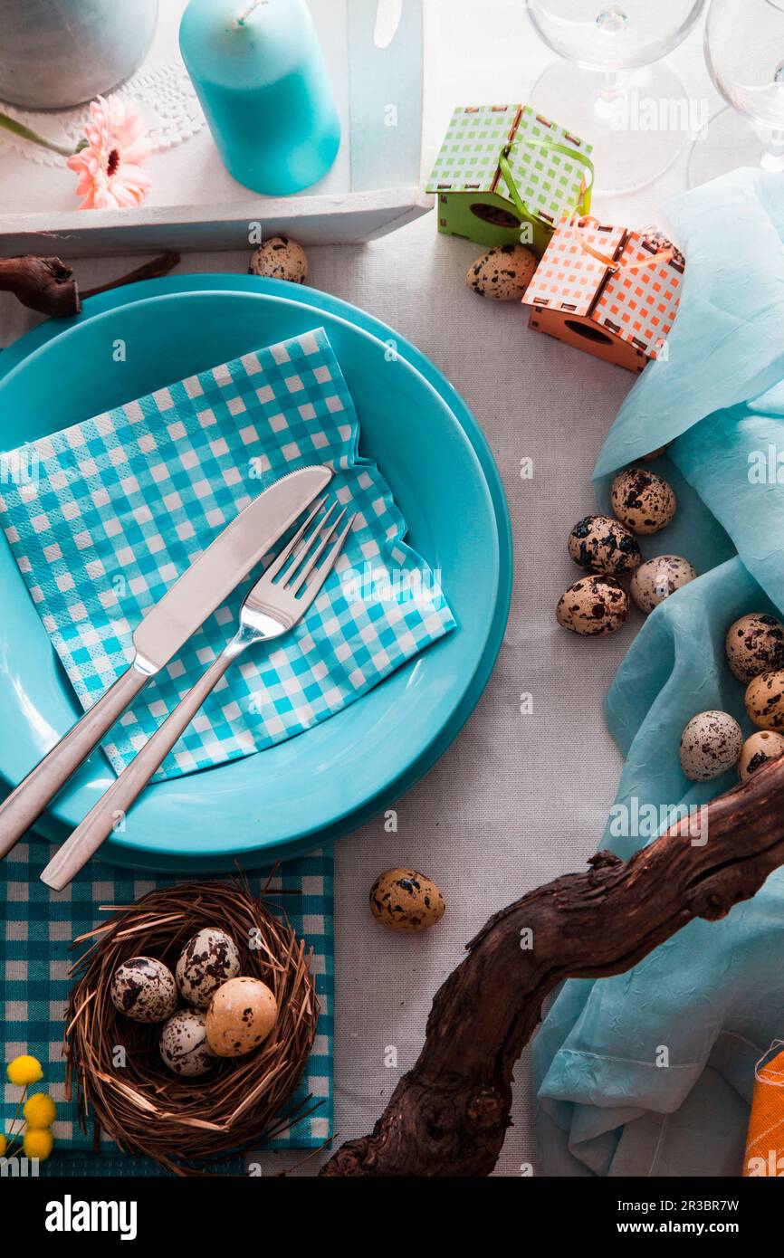 Easter table setting with quail eggs Stock Photo