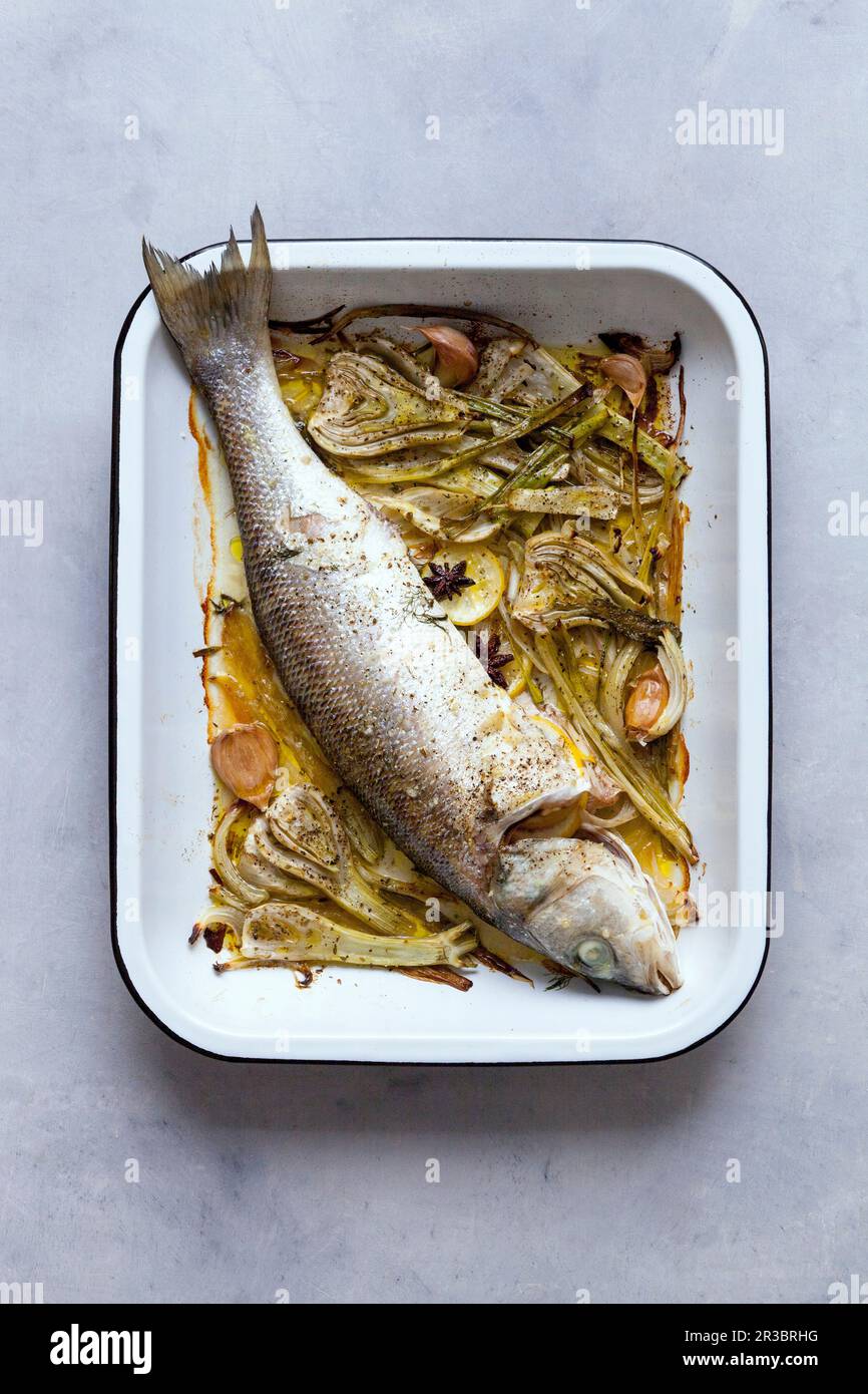 Baked sea bass with fennel Stock Photo - Alamy