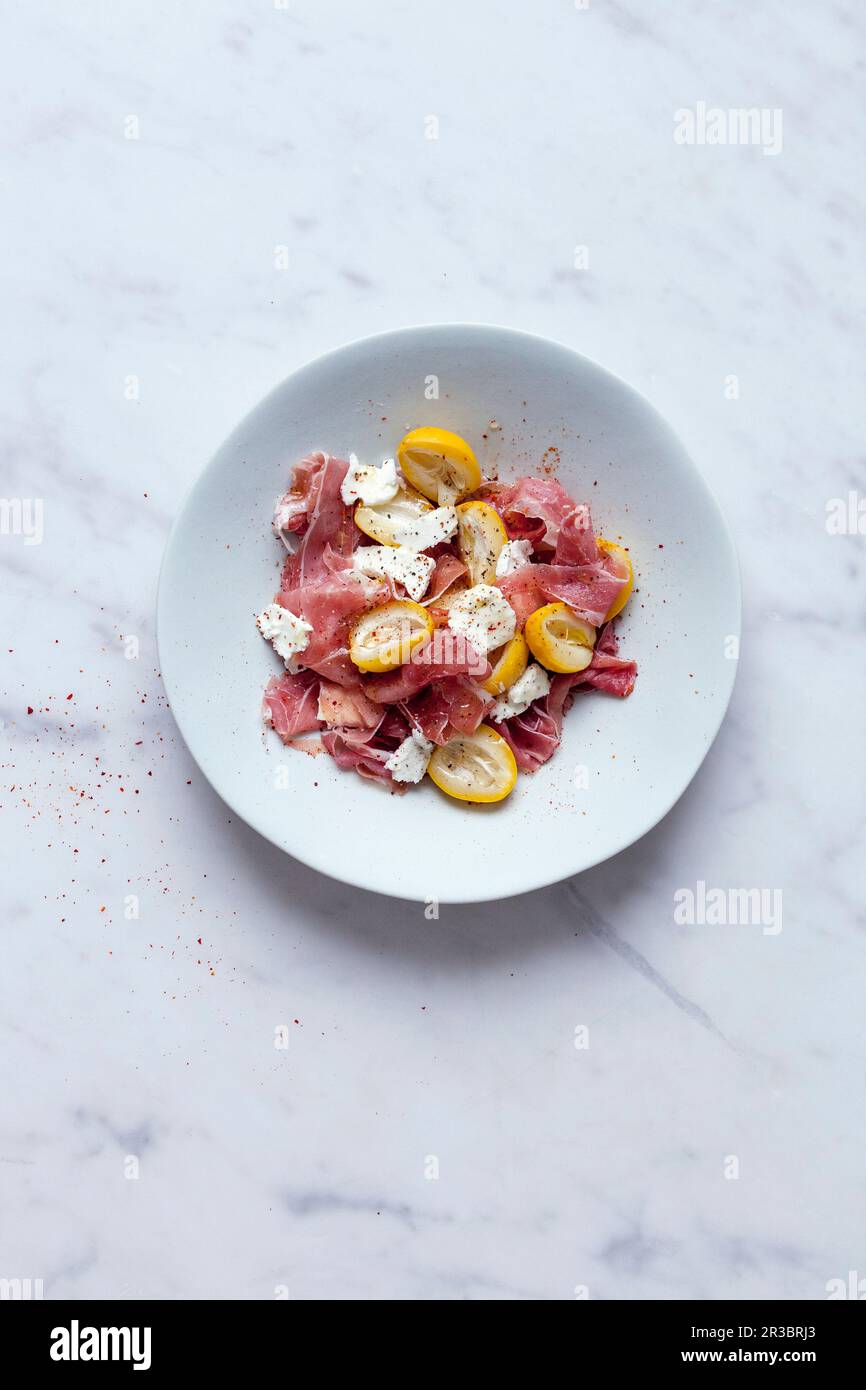 Fresh dates salade with parma ham and goat cheese Stock Photo Alamy