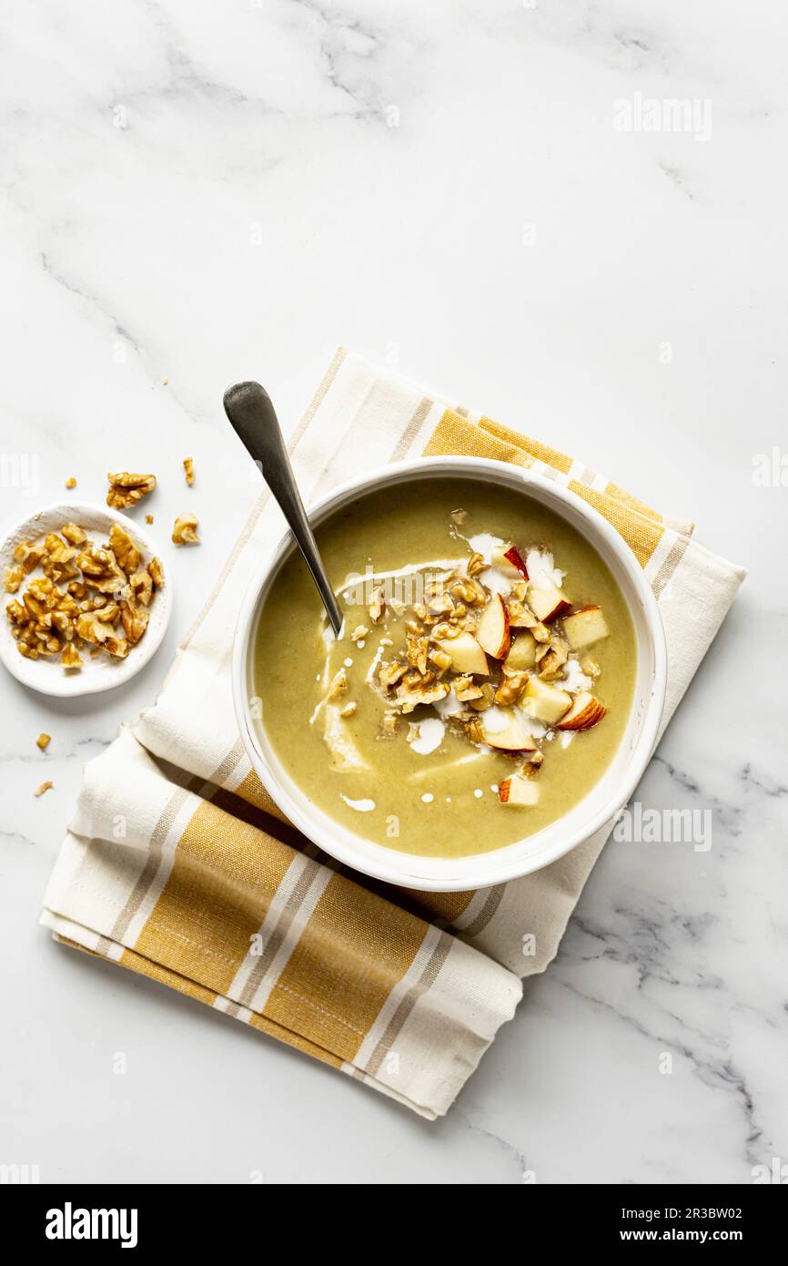 Celeriac soup with apple and walnuts Stock Photo