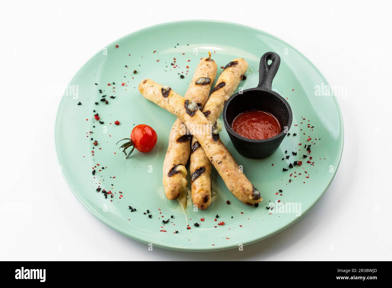 Grilled German sausages with hot tomato sauce Stock Photo Alamy