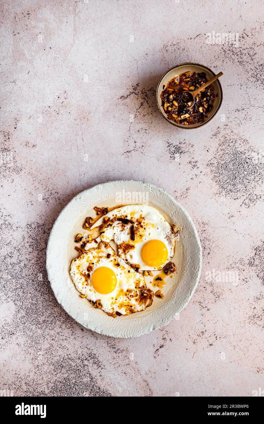 Fried eggs with chili crisp oil Stock Photo Alamy