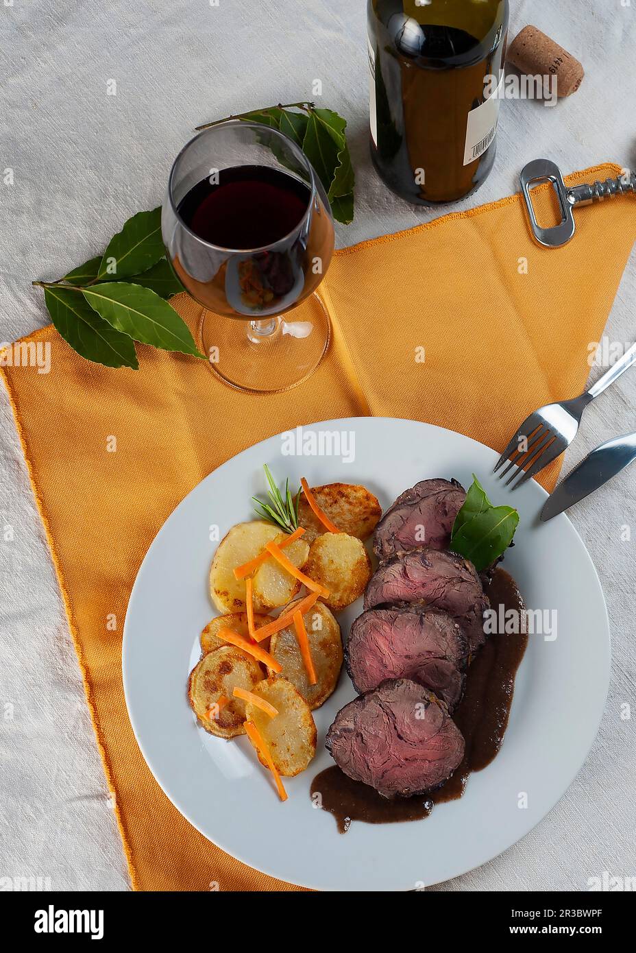 Braised beef in Barolo, with roasted potatoes and julienne carrots Stock Photo