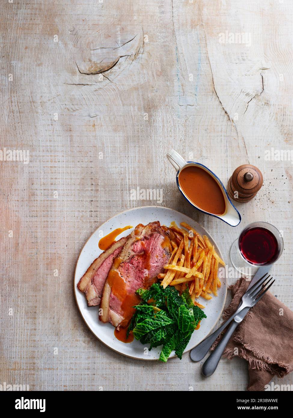 Roast yearling beef with french fries and kale Stock Photo Alamy
