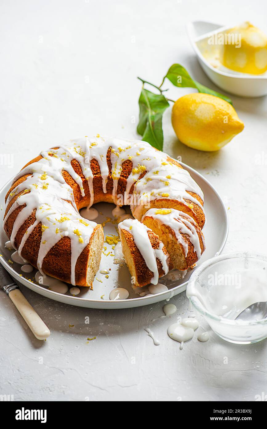 Lemon drizzle bundt cake with lemon icing Stock Photo Alamy