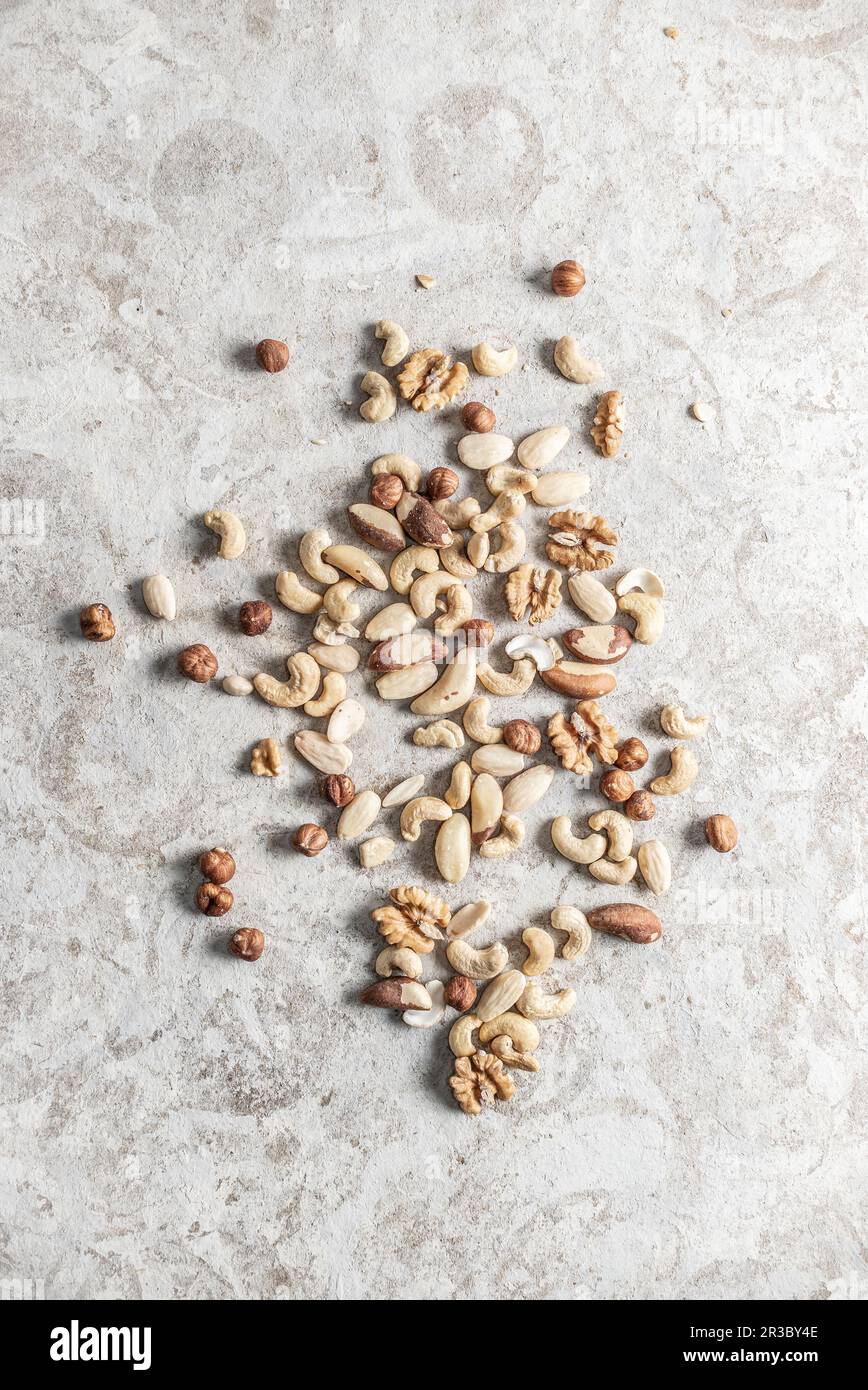 Mixed Nuts on a gray background Stock Photo