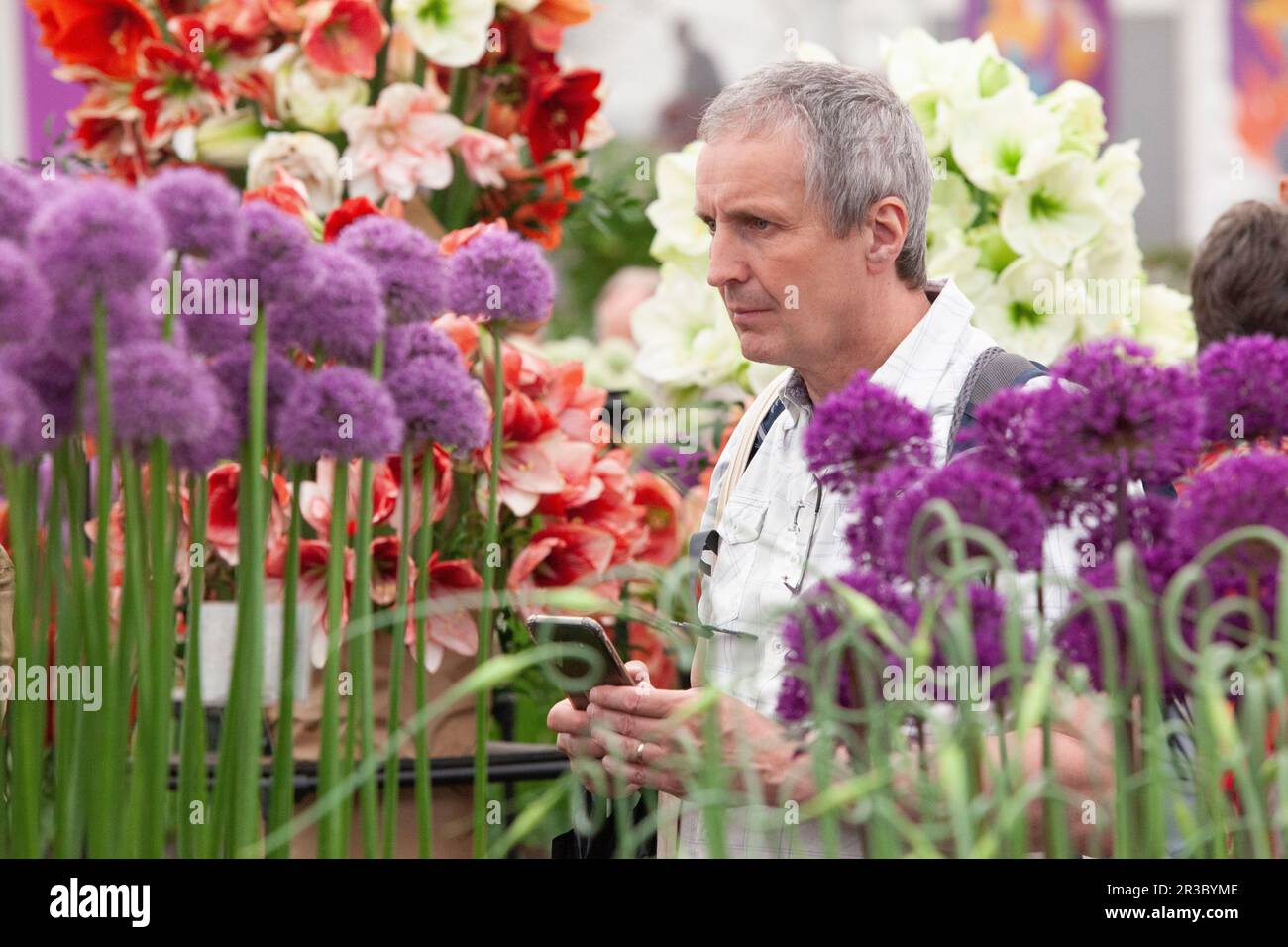 London, UK. 23rd May, 2023. The RHS Chelsea Flower Show opens to the public, with a sea of straw hats and floral dresses surrounding each of the show gardens. In the Grand Pavillion specialist plant growers draw crowds and sell bulbs, plants and seeds. Credit: Anna Watson/Alamy Live News Stock Photo
