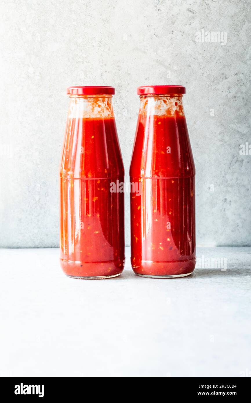 Tomato sauce in glass bottles Stock Photo - Alamy