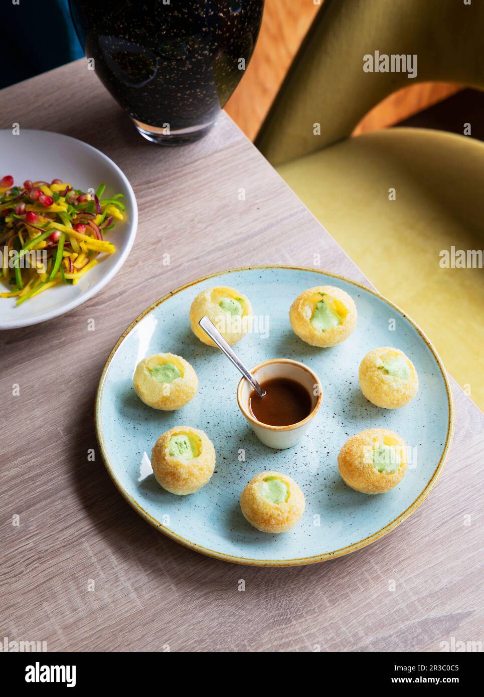 Indian mint yoghurt potato balls Stock Photo Alamy
