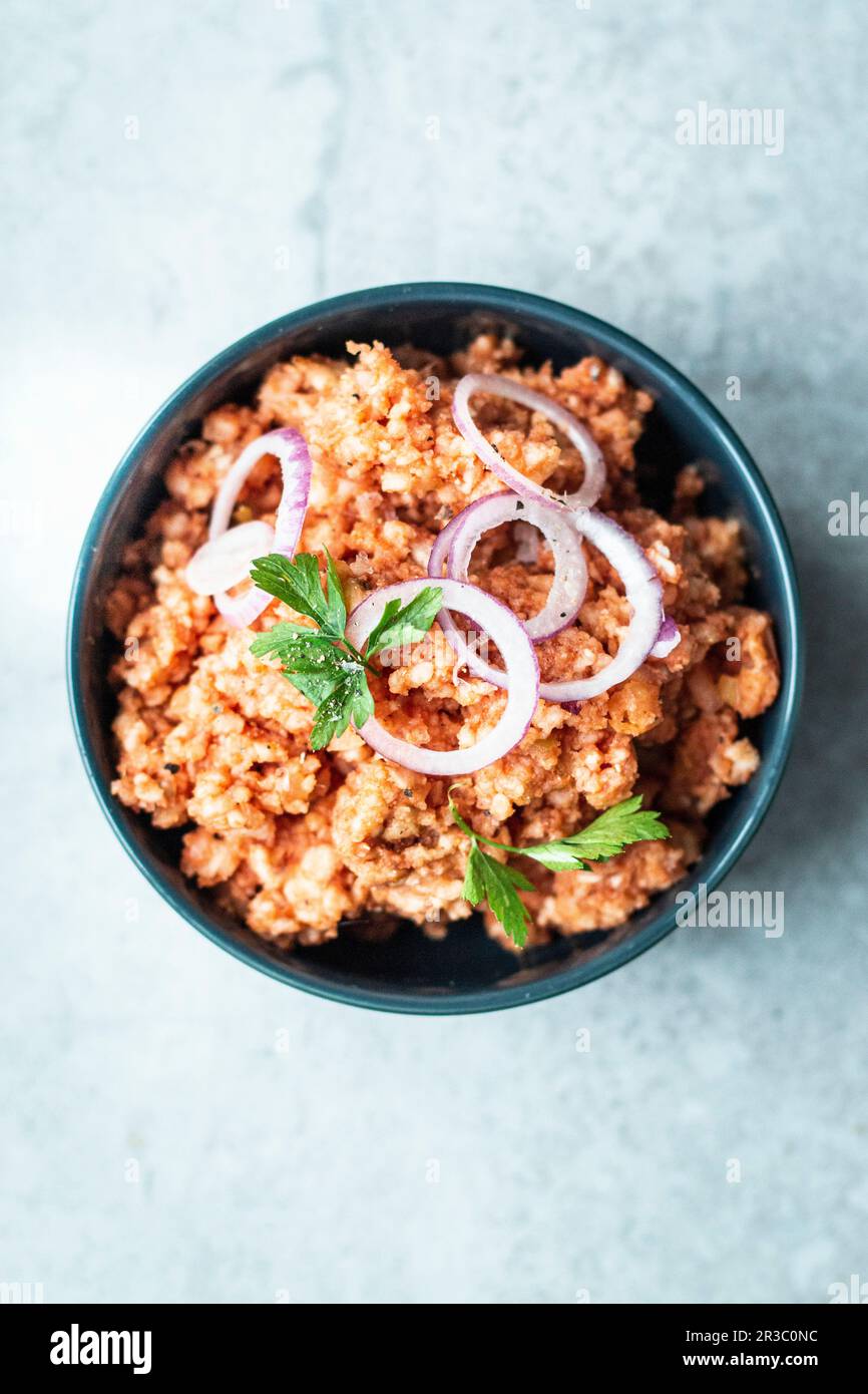Vegan 'Mett' made from rice wafers, tomato paste, onions and spices Stock Photo