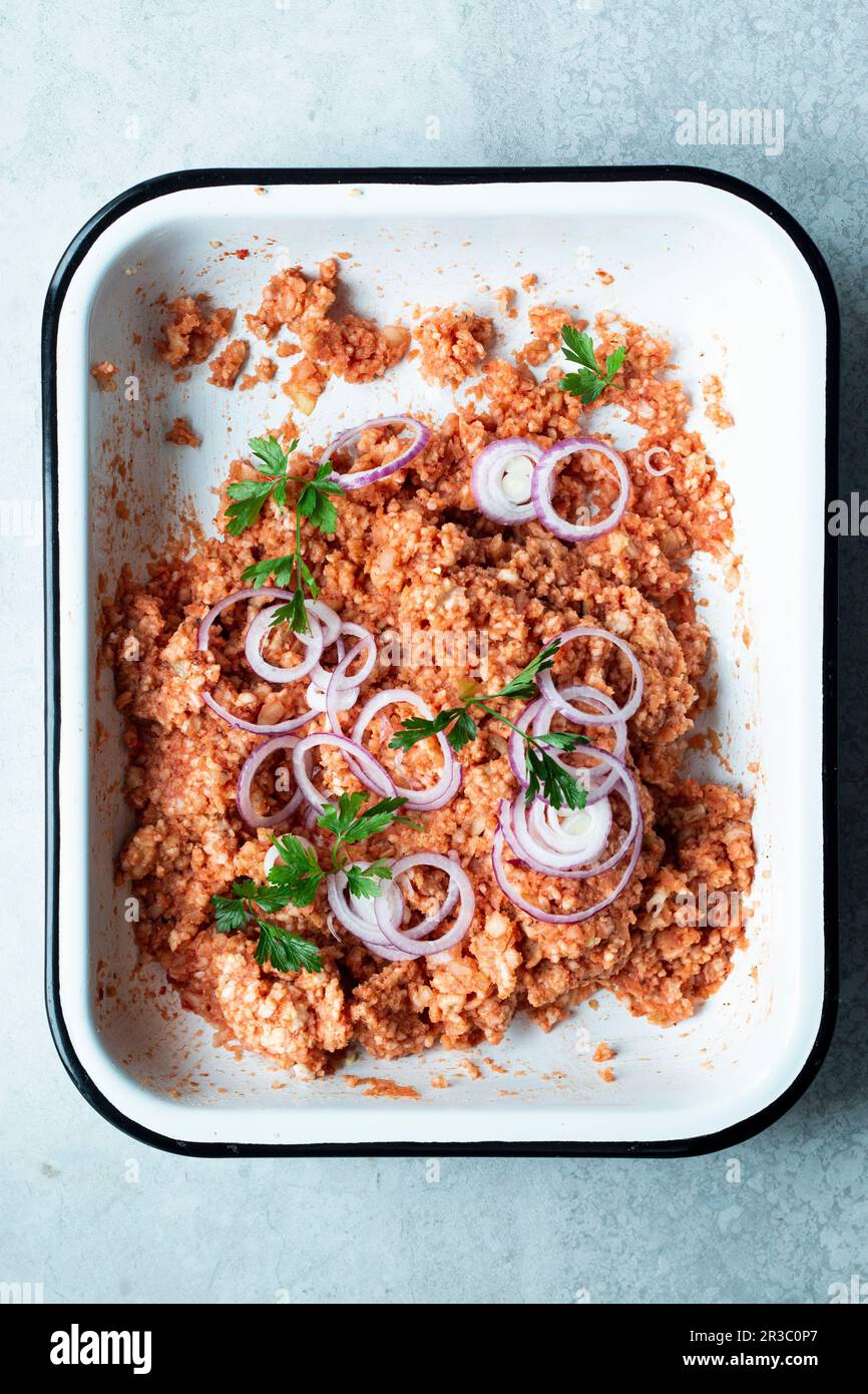 Vegan 'Mett' made from rice wafers, tomato puree, onions and spices Stock Photo