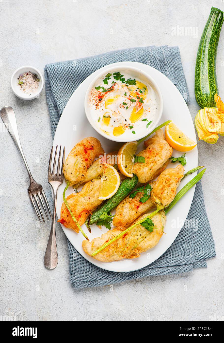 Deep fried stuffed courgette flowers with yoghurt dip Stock Photo Alamy