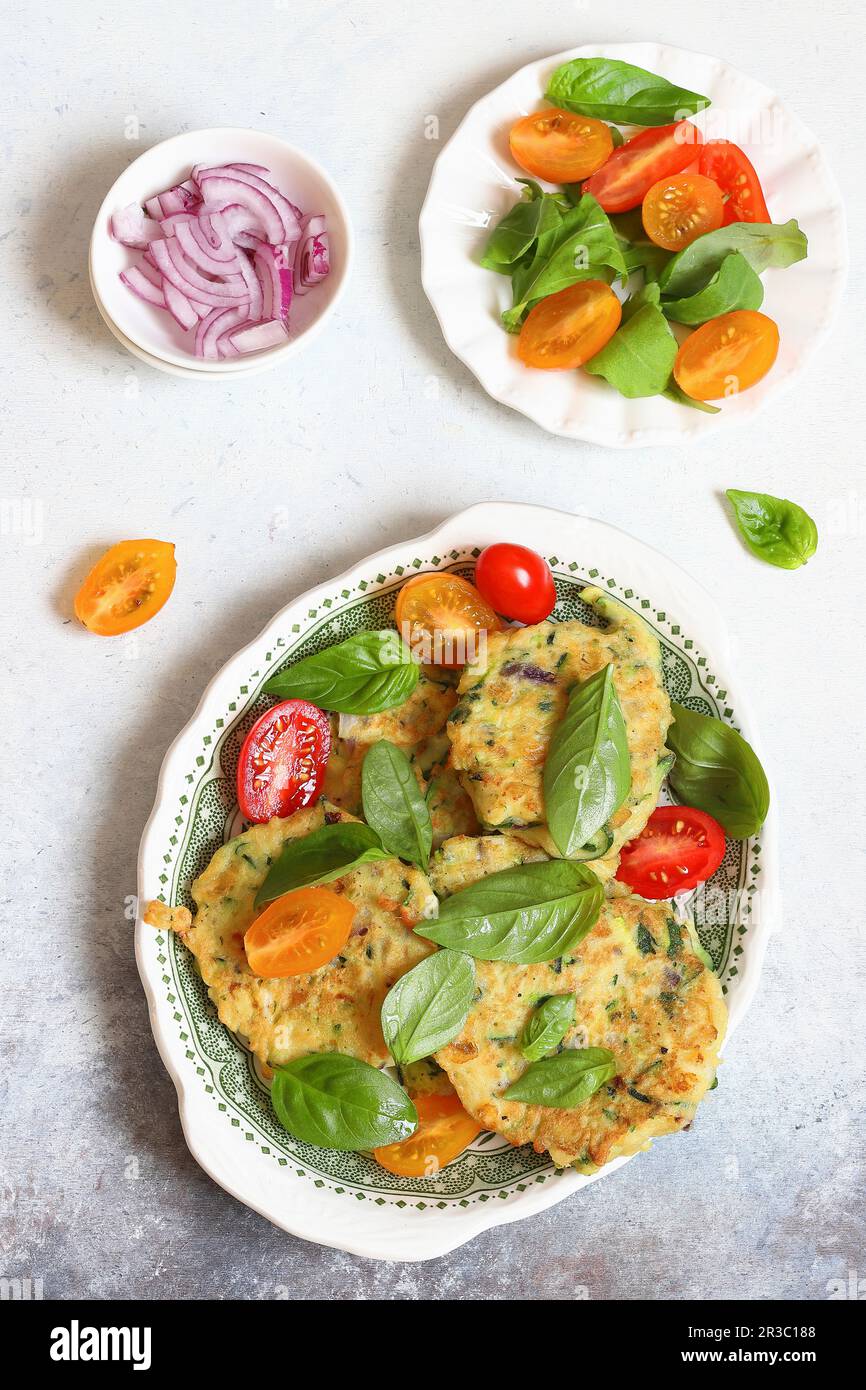 Courgette cakes with scamorza cheese Stock Photo