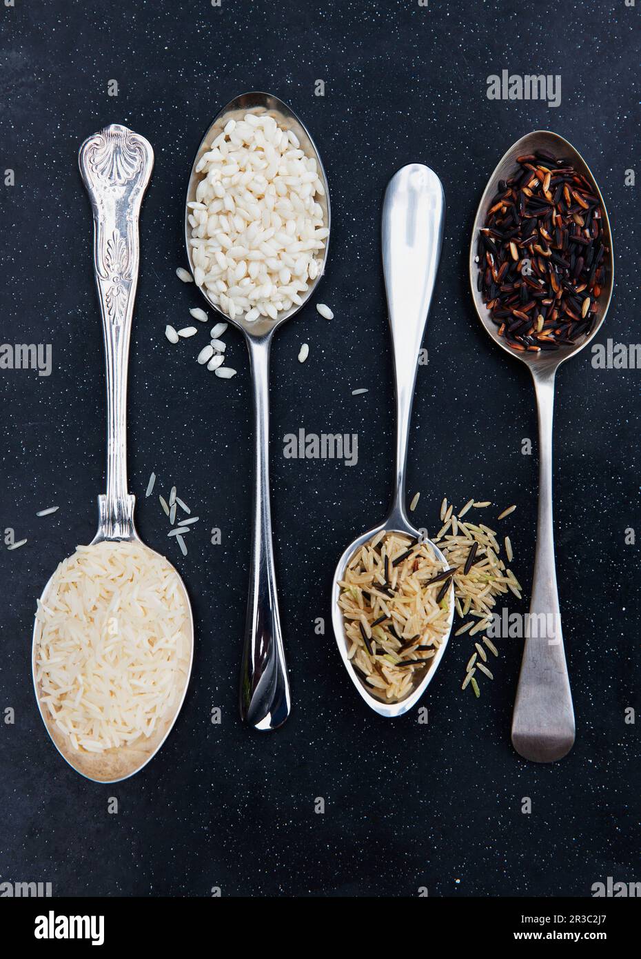 Various types of rice on spoons Stock Photo - Alamy