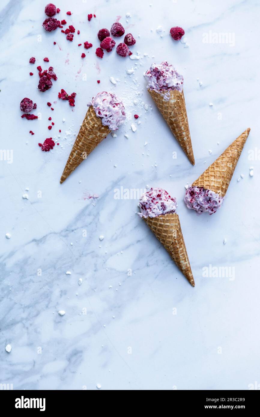 Raspberry and sour cream ice cream in cones Stock Photo - Alamy