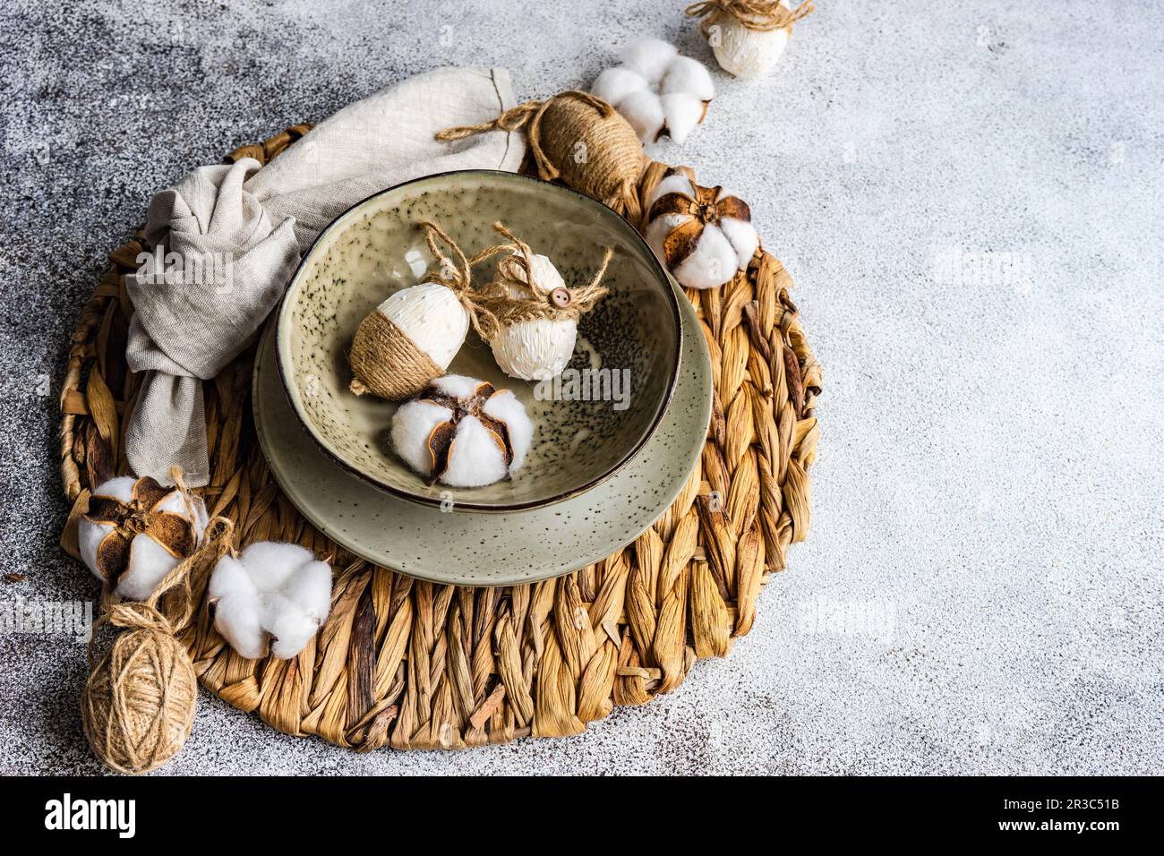 Easter festive table setting with tiny eggs and tableware on stone background Stock Photo