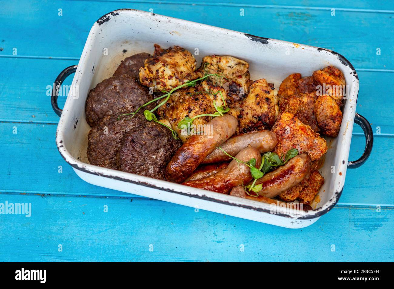 Grilled burgers, chicken, pork and sausages Stock Photo Alamy