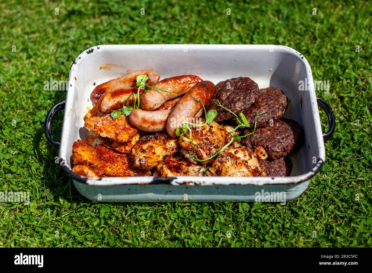 Grilled burgers, chicken, pork and sausages Stock Photo Alamy