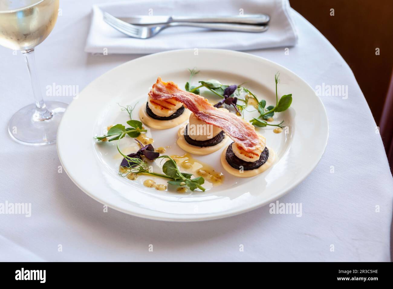 Black pudding, scallop, and bacon appetizers Stock Photo Alamy