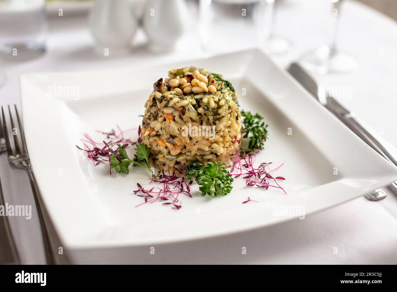 Spinach risotto timbale with pine nuts Stock Photo Alamy