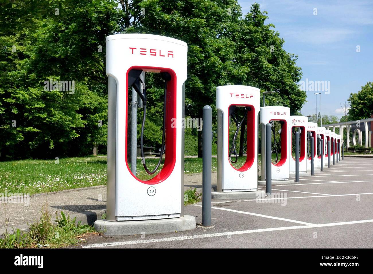 HAUCONCOURT, FRANCE - MAY,19,2023: Tesla Supercharger Station for electric cars. Tesla is an American electric vehicle and clean energy company based Stock Photo