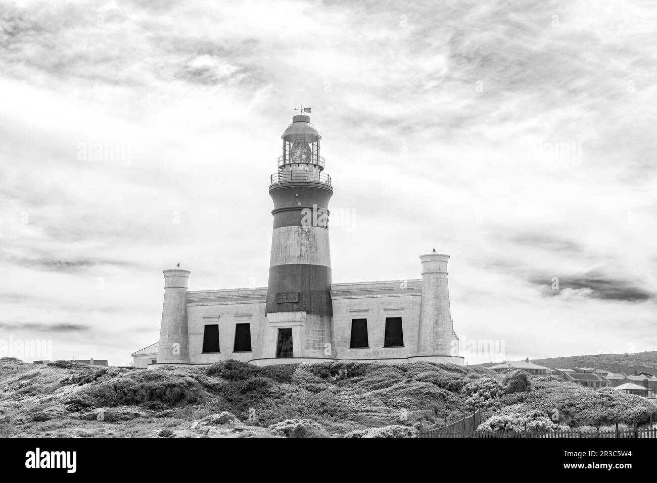 Agulhas National Park, South Africa - Sep 21, 2022: The historic Agulhas lighthouse at the most southern tip of Africa. Monochrome Stock Photo
