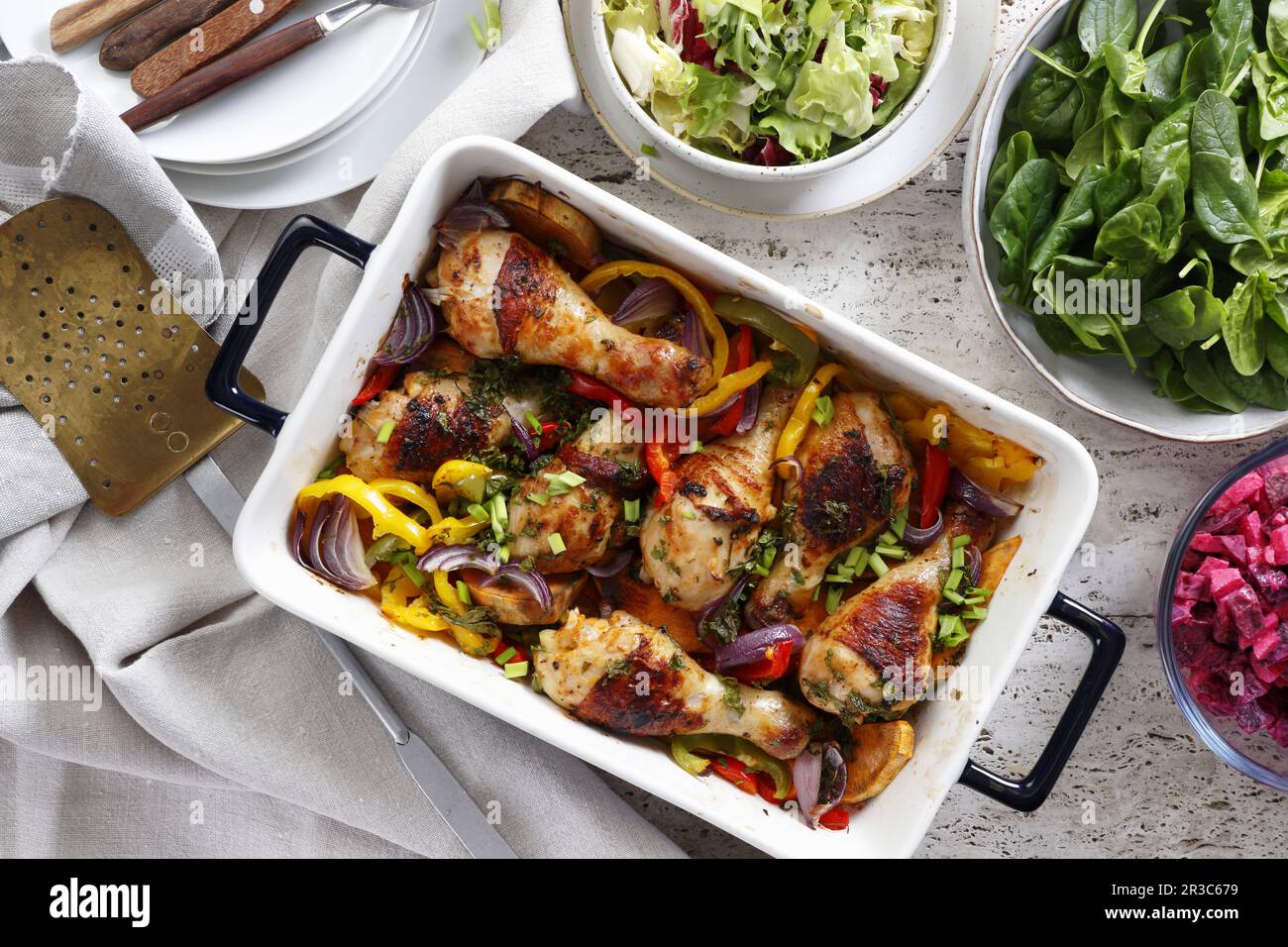 Baked chicken drumsticks with vegetables Stock Photo Alamy