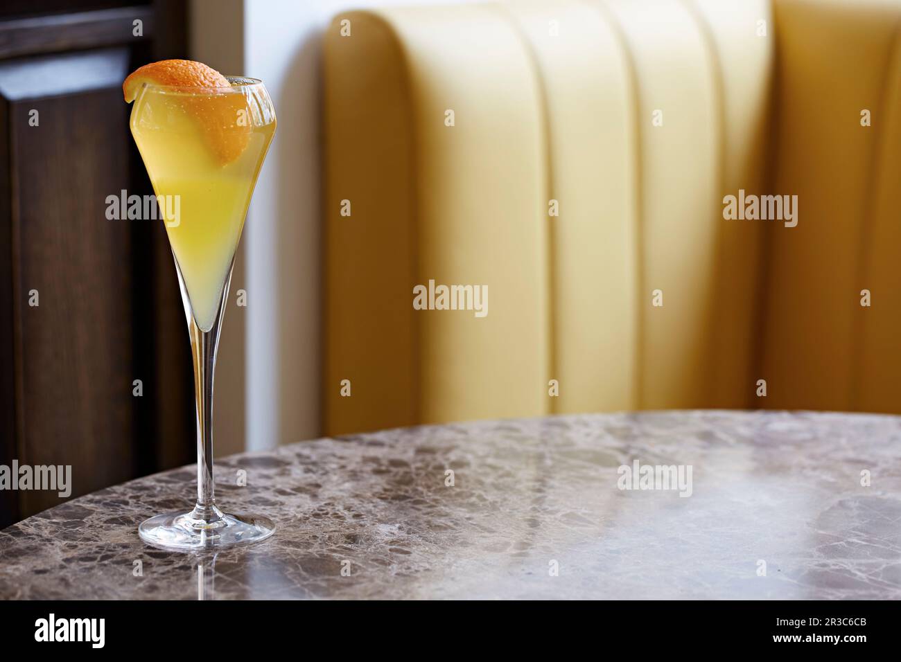 Bucks fizz, champagne cocktail, garnished with fresh orange peel Stock Photo