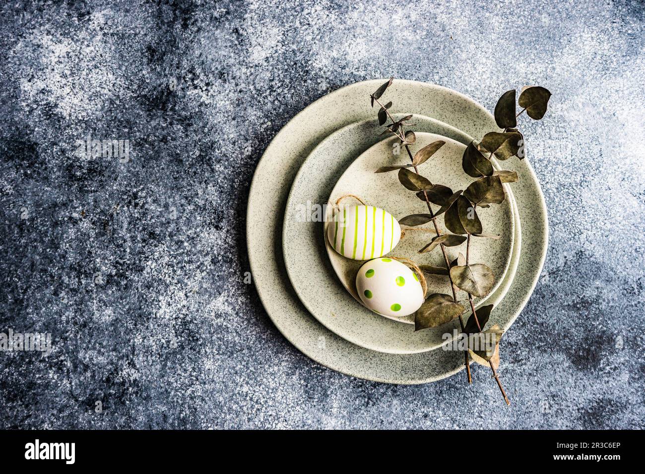 Easter minimalistic place setting with colored eggs Stock Photo