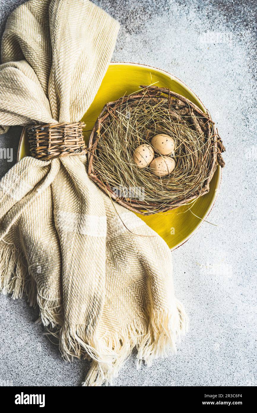 Easter minimalistic place setting on concrete background Stock Photo