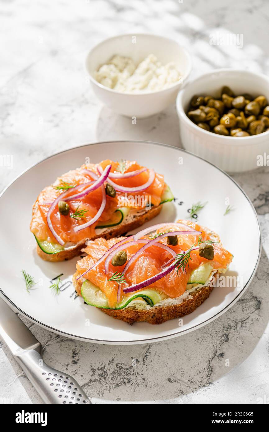 Sandwiches with salmon, cucumber and capers Stock Photo
