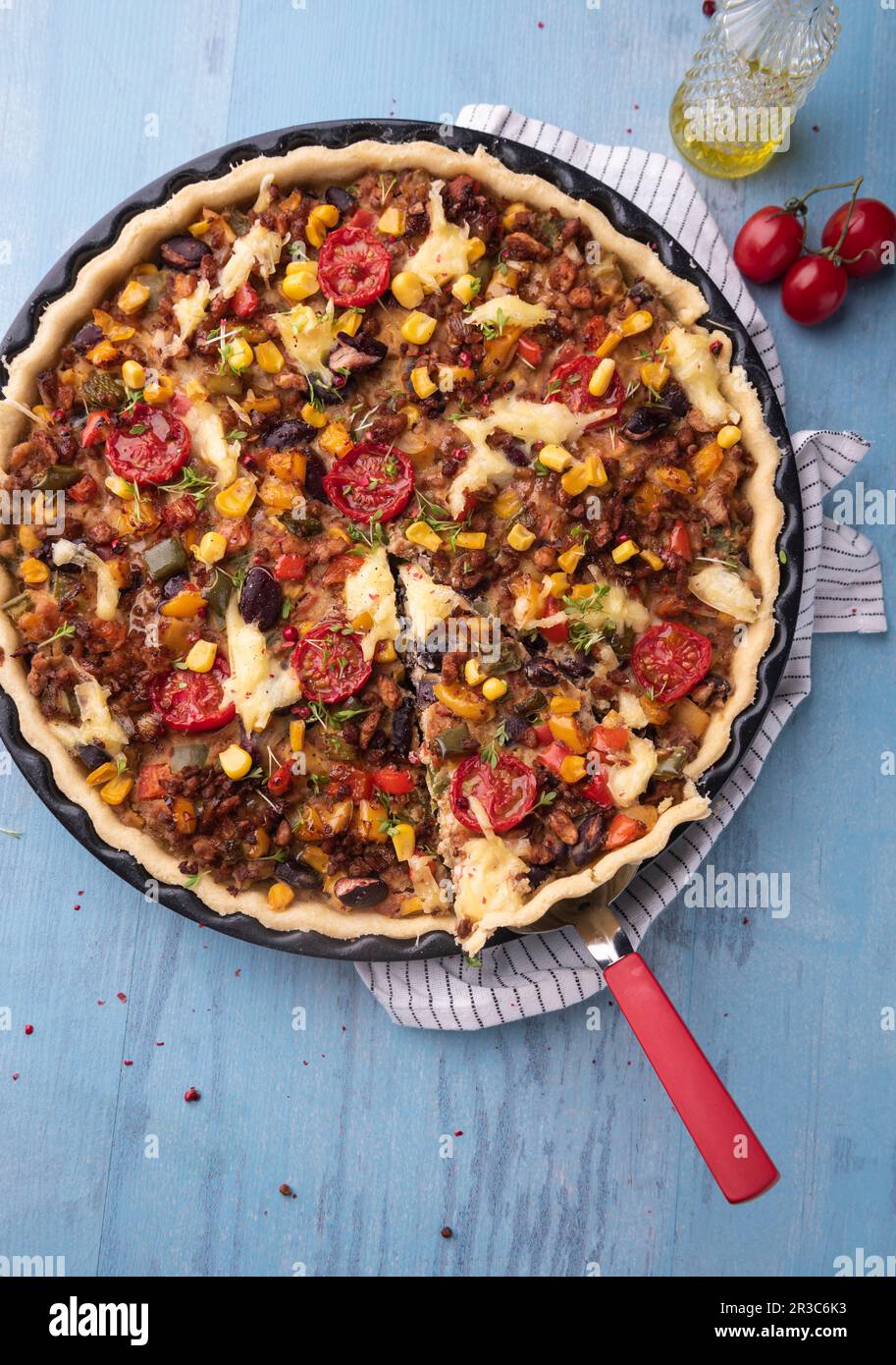 Vegan quiche 'Mexican Style' with soya mince, kidney beans and corn Stock Photo
