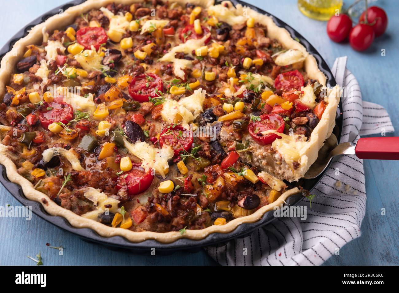 Vegan 'Mexican Style' quiche with soya mince, kidney beans and corn Stock Photo
