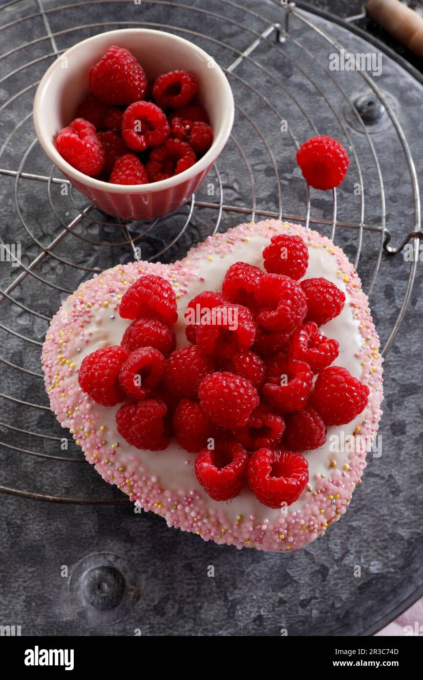 Heart-shaped cake with raspberries Stock Photo - Alamy