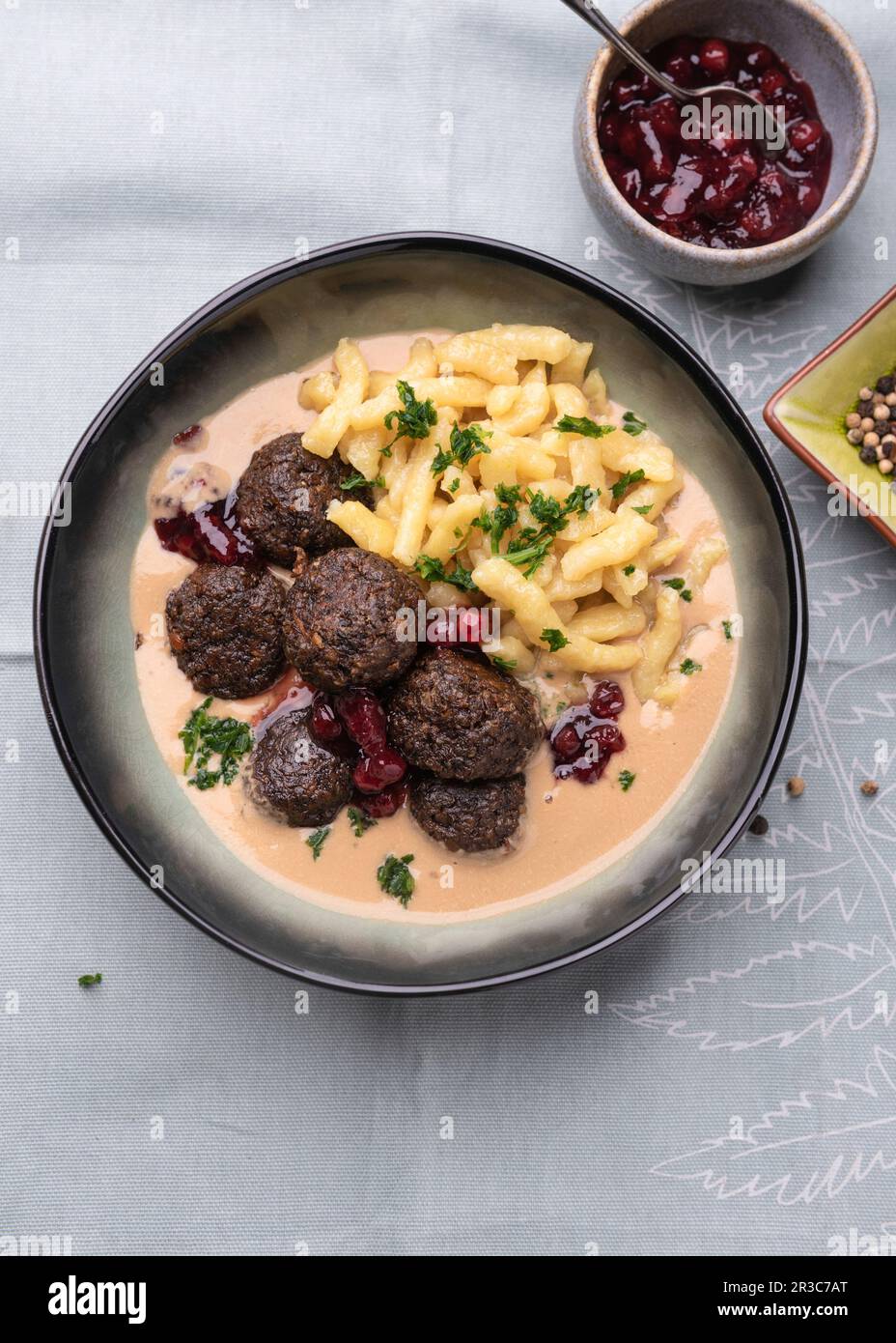 Vegan 'Köttbullar' made from lentils with cranberries and spaetzle Stock Photo