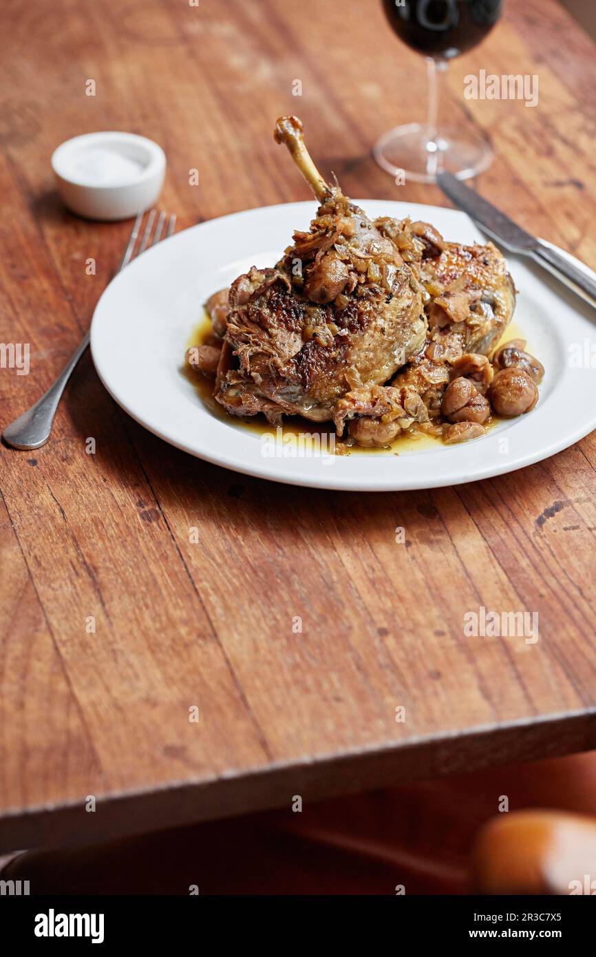 Duck confit with chesnuts Stock Photo - Alamy