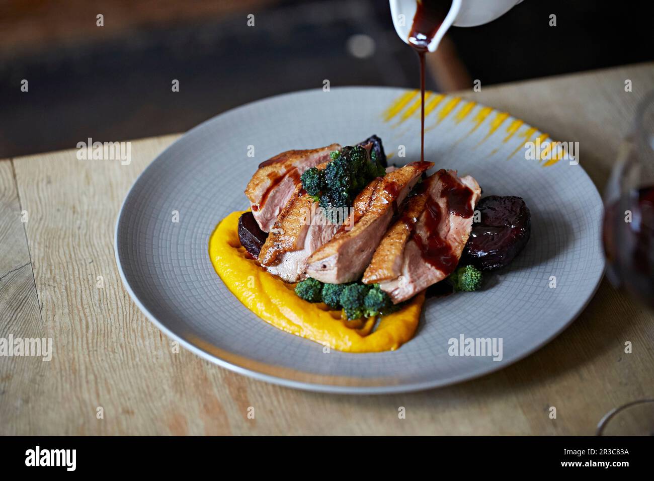 Gravy being poured on Roast duck Stock Photo - Alamy