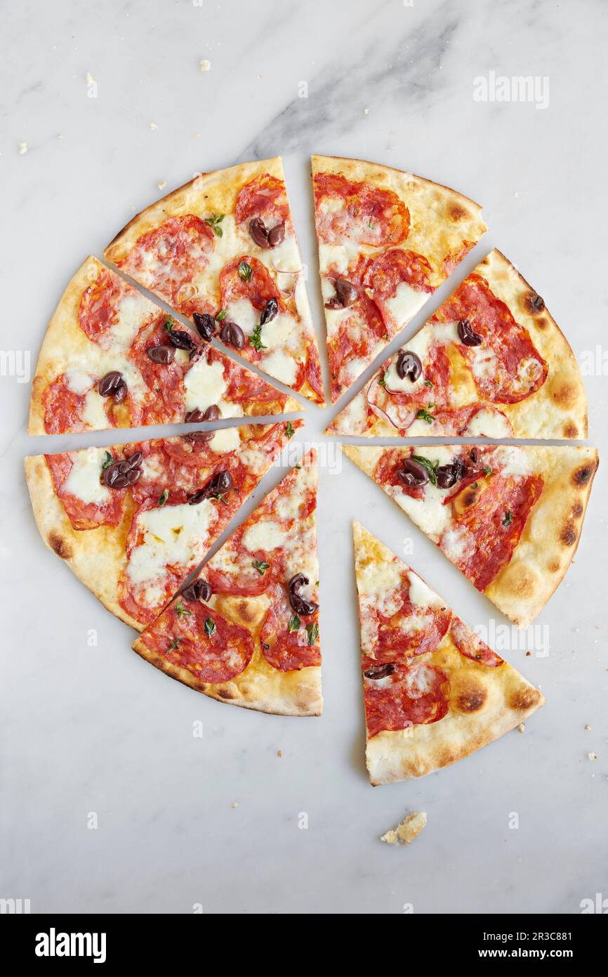 Pepperoni pizza with sliced black olives Stock Photo Alamy